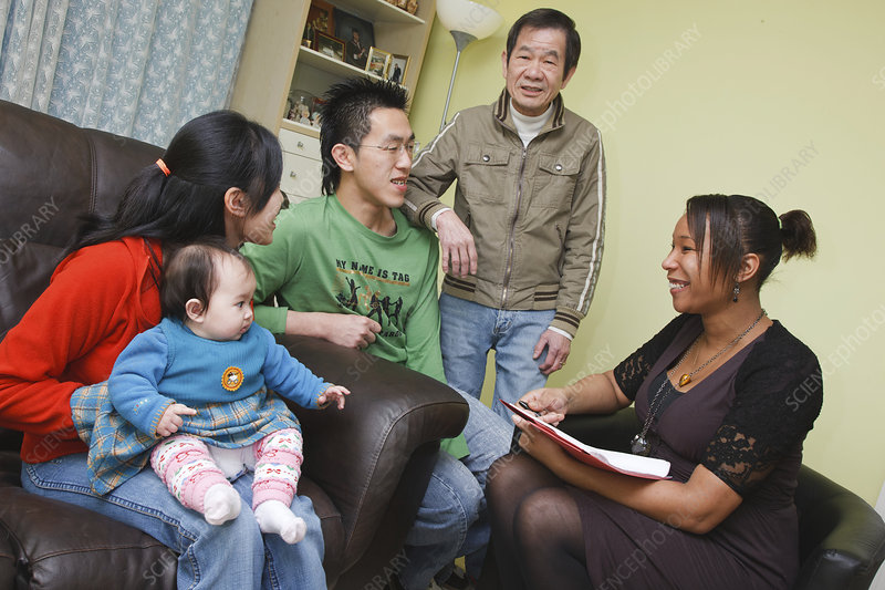Caseworker having monthly visit with family